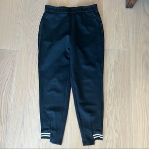 Black joggers asymmetrical bottom trim accent size large stretchy elastic